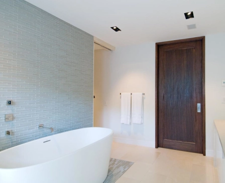 a bathroom with a modern brown door